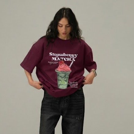 Burgundy oversized graphic T-shirt featuring a Strawberry Matcha drink print on the front with soft premium cotton fabric.