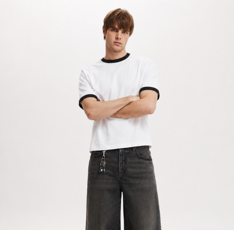 White ringer T-shirt featuring black contrast collar and sleeve cuffs, crafted from premium soft cotton for all-day comfort.