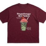 Burgundy oversized graphic T-shirt featuring a Strawberry Matcha drink print on the front with soft premium cotton fabric.
