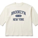 Off-white oversized long sleeve T-shirt featuring a Brooklyn New York graphic print on the front, crafted from soft premium cotton for everyday comfort.